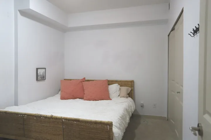 Bedroom featuring a closet and baseboards