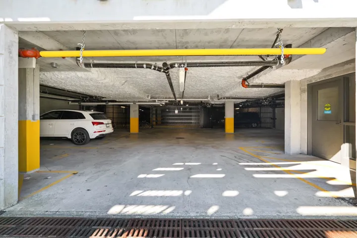 Concrete parking garage with marked parking spaces