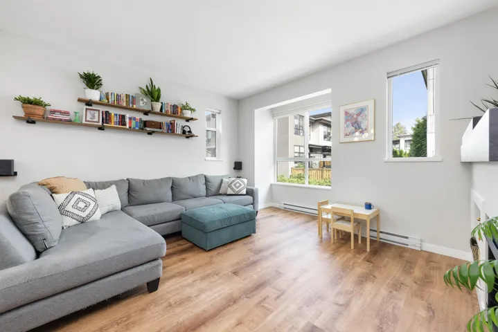 Living area featuring light wood finished floors and baseboard heating