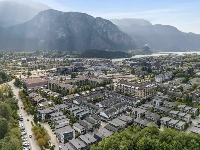 Aerial view of property and surrounding area featuring mountains