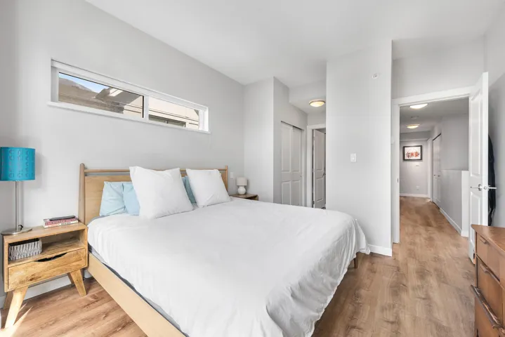 Bedroom with light wood-type flooring and a closet