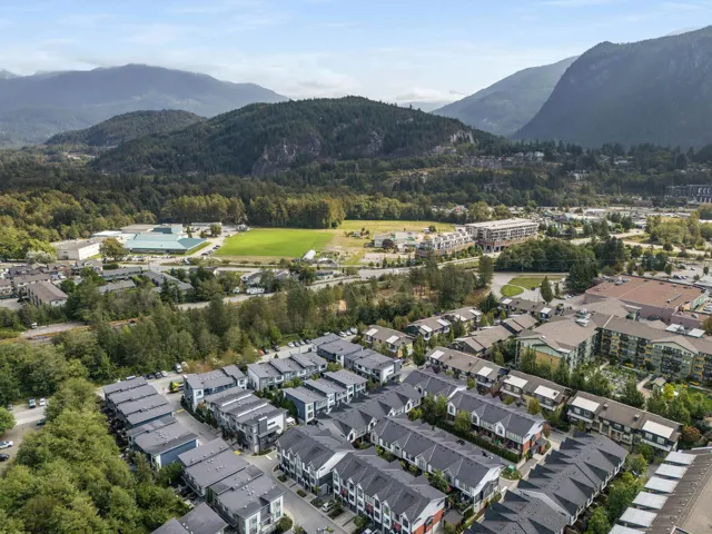 Aerial overview of property's location featuring a mountainous background