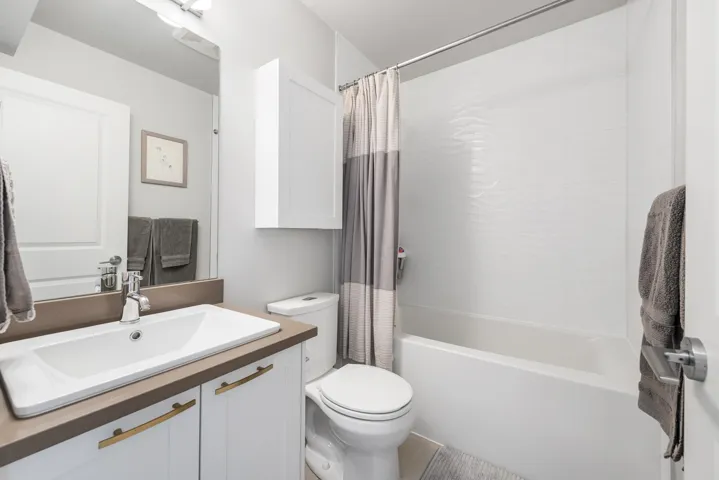 Full bath with shower / bath combo and vanity