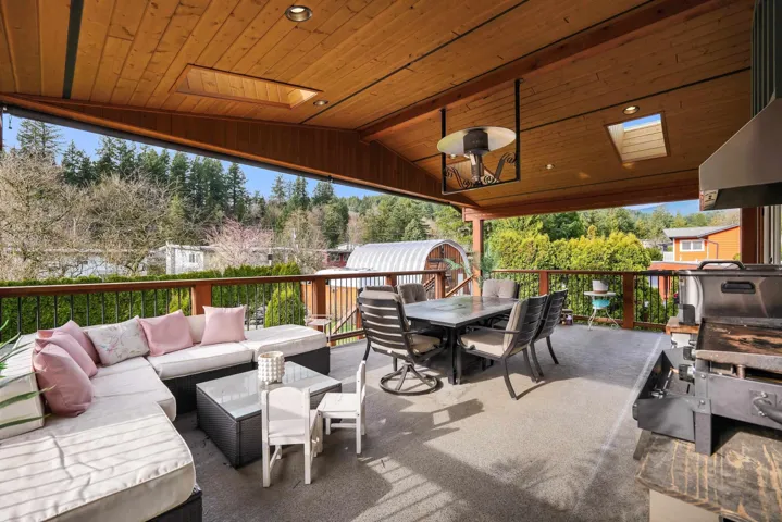 View of patio with an outdoor living / dining area, a storage shed, and area for grilling