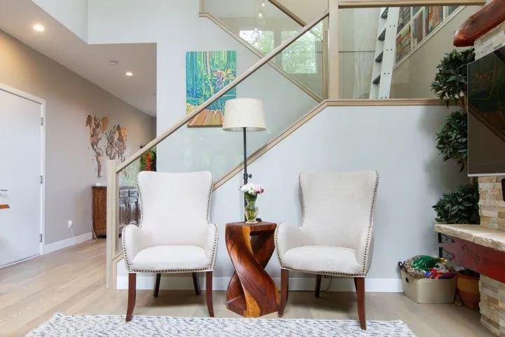 Living area featuring recessed lighting, wood finished floors, and baseboards