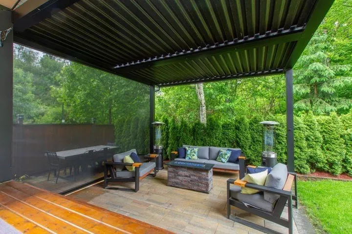 View of patio with outdoor lounge area and a view of trees