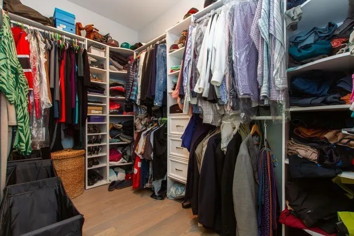 Walk in closet featuring wood finished floors