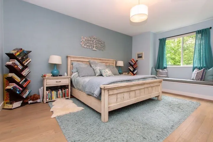 Bedroom with baseboards and wood finished floors