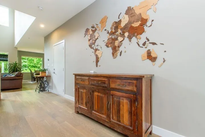 Hallway with baseboards and light wood-style floors