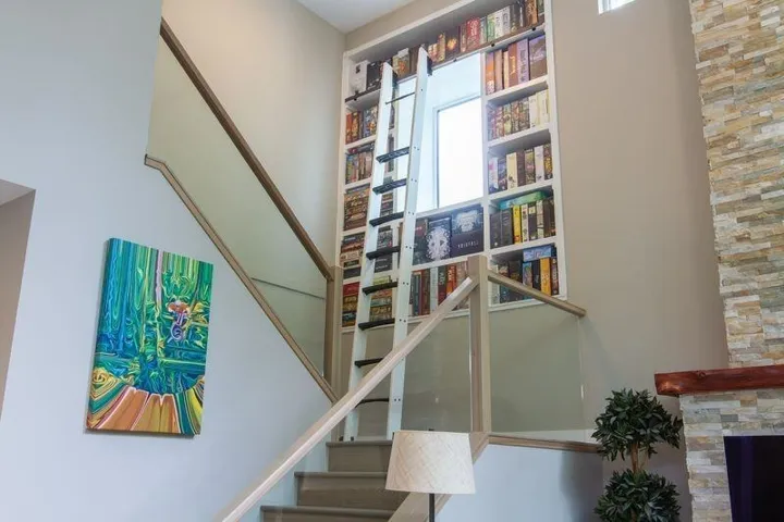 Stairway featuring a fireplace