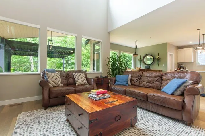 Living area featuring light wood finished floors and baseboards