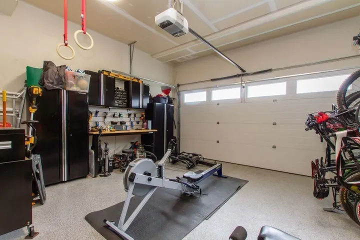 Garage featuring a garage door opener