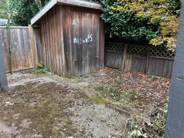View of shed featuring a fenced backyard