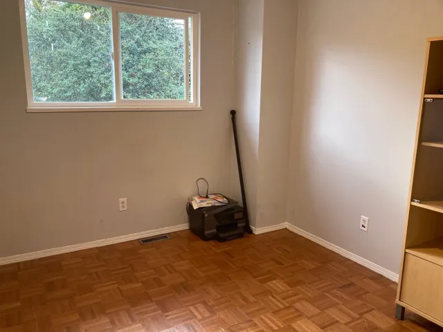 Unfurnished room featuring baseboards