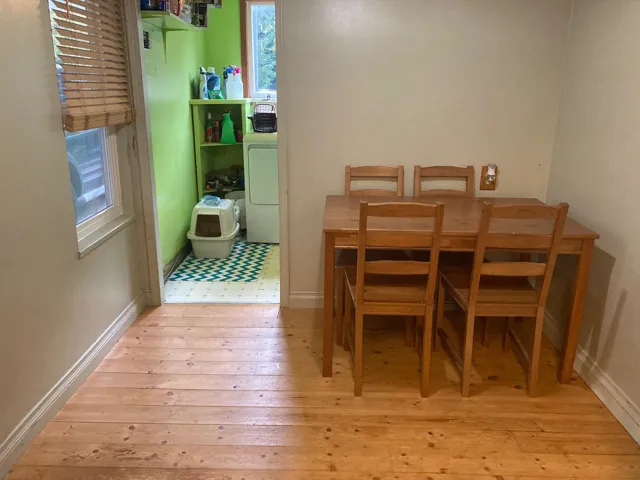 Dining room featuring light wood-style flooring and washer / dryer