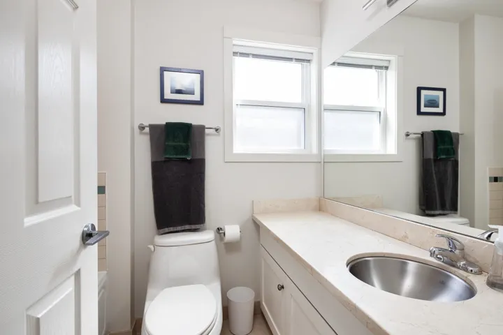 Full bathroom with toilet and vanity