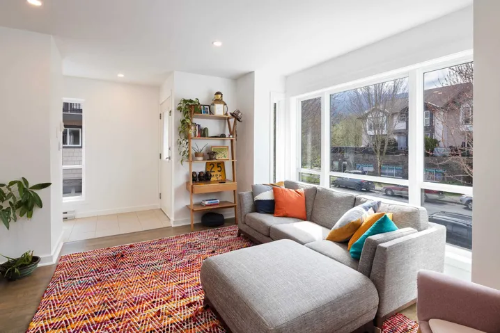Living area featuring wood finished floors, baseboards, and recessed lighting
