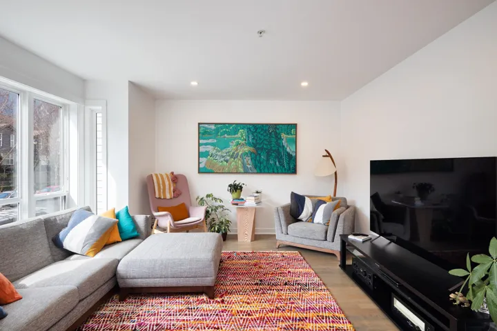 Living area featuring light wood-style floors and recessed lighting