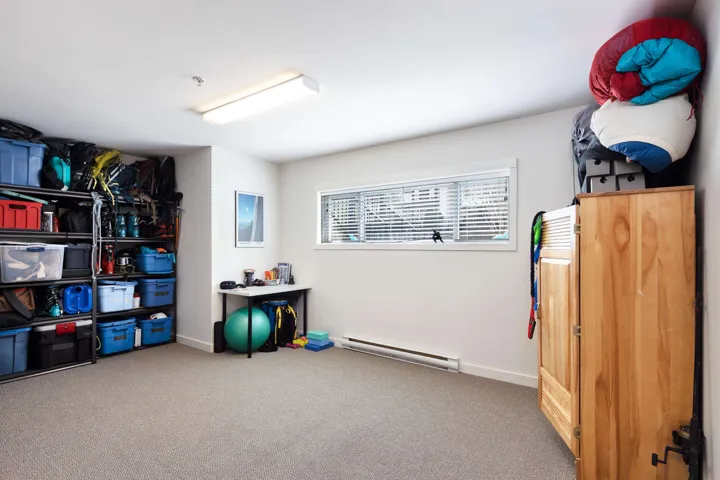 Storage room featuring baseboard heating