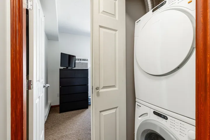 Stacked washer and dryer unit