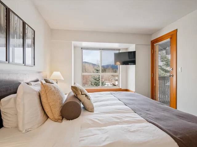 Bedroom with multiple windows