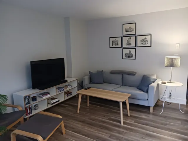Neutral-toned interior space featuring wood-finish flooring and smooth wall finishes