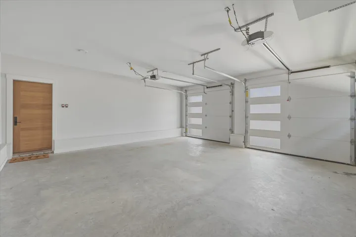 Spacious two-car garage with concrete flooring