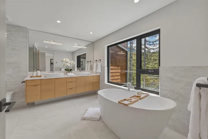 One of 3 additional bedrooms all similar in size, in addition to the primary bedroom