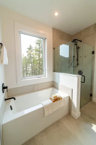 Bathroom with a garden tub, a stall shower, and recessed lighting