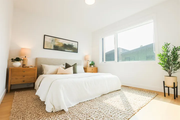 Bedroom featuring light wood finished floors and baseboards