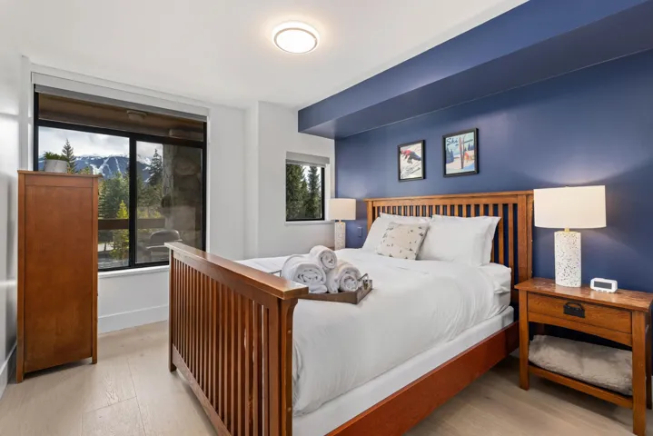 Bedroom featuring baseboards and wood finished floors