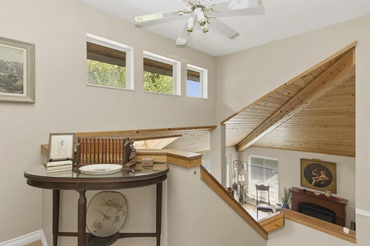 Vaulted wood-paneled ceiling with exposed beams