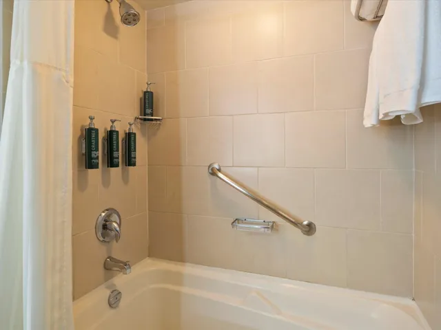 Full bathroom with shower / bath combination with curtain