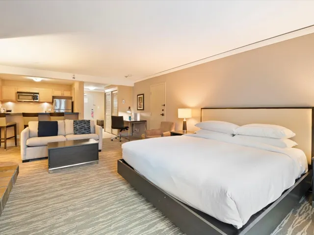 Bedroom with stainless steel refrigerator