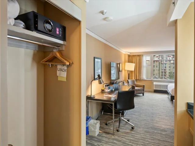 Office featuring radiator heating unit, carpet flooring, and ornamental molding