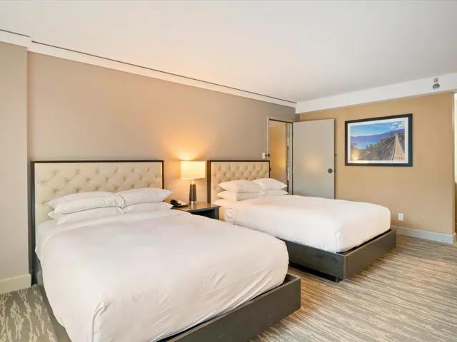 Carpeted bedroom featuring baseboards