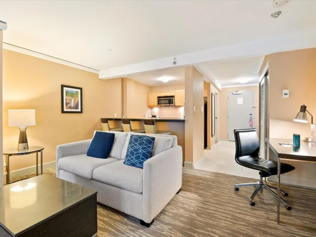 Living room featuring crown molding and baseboards