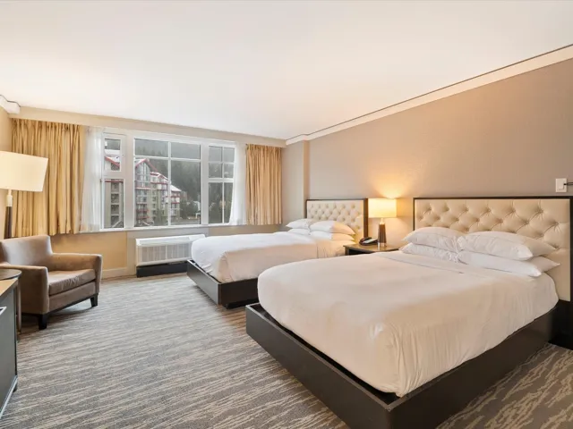 Carpeted bedroom featuring a wall mounted air conditioner