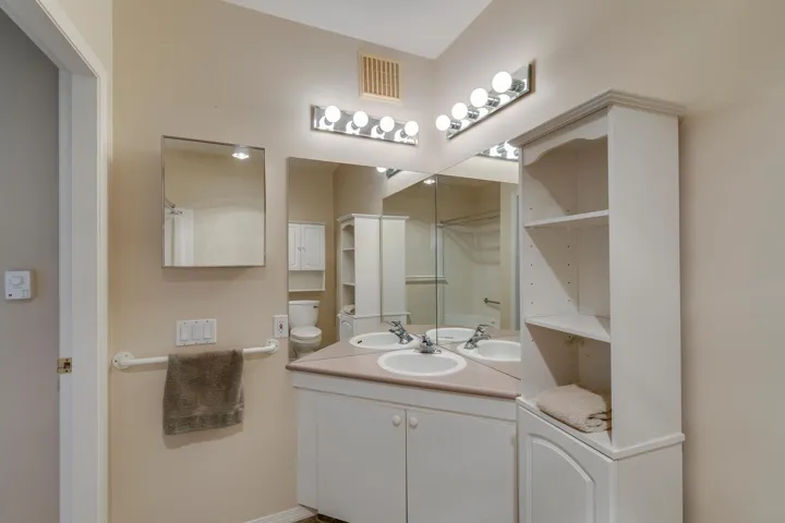 Full bath with vanity, bathtub and a shower