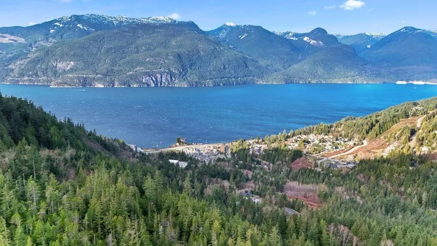 View of mountain backdrop featuring a large body of water