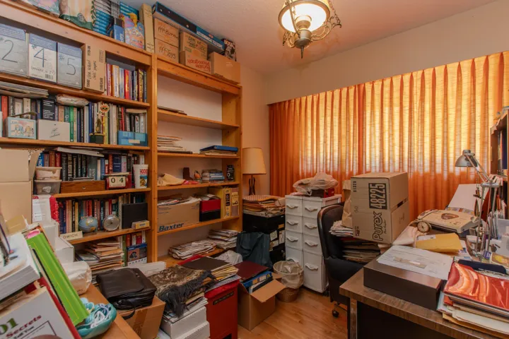 Office featuring light wood-style floors and a textured ceiling
