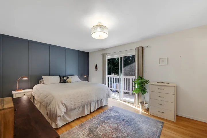 Bedroom featuring light wood-type flooring and access to exterior