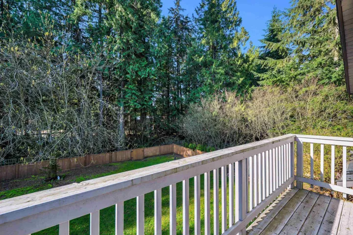 Wooden terrace featuring a fenced backyard