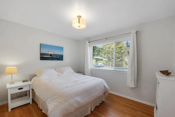 Bedroom with light wood-style floors