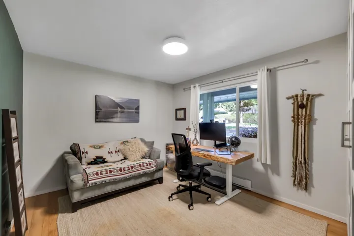 Office featuring light wood-style floors and baseboards