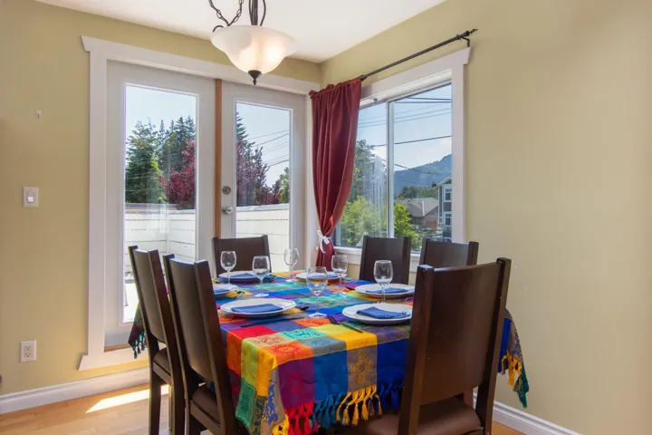 Dining room with healthy amount of natural light and wood finished floors
