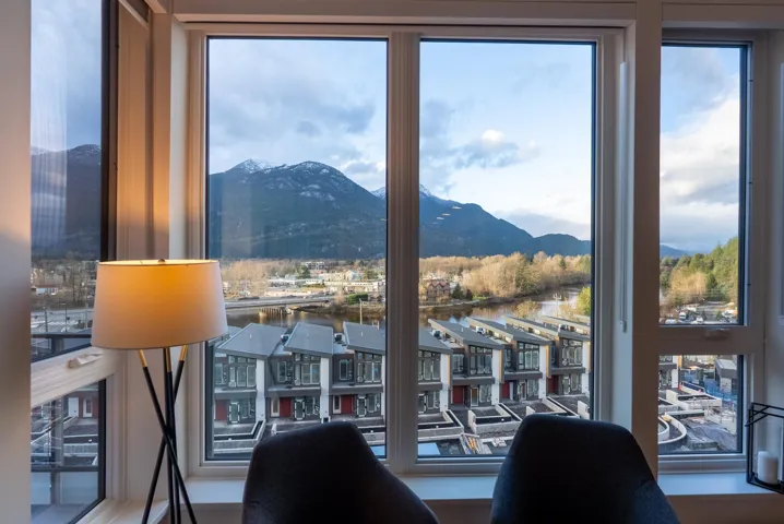 Dining space featuring a water and mountain view and plenty of natural light