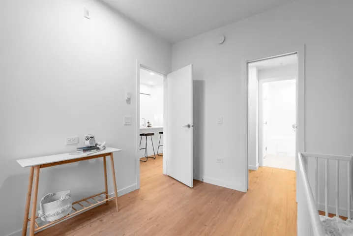 Bedroom with light wood-style floors and baseboards