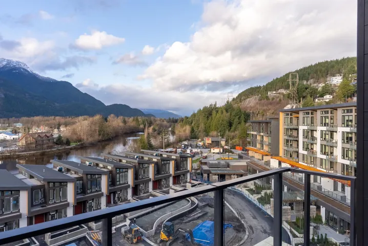 Balcony with a water and mountain view