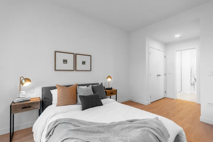 Bedroom featuring light wood finished floors, a closet, and recessed lighting